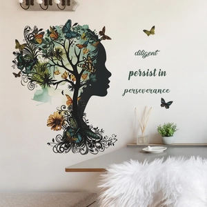 Detail of creative tree silhouette wall decal with colorful butterflies and text