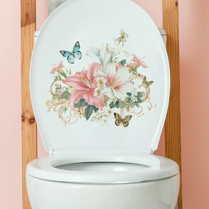 Floral toilet lid decal featuring pink lilies and butterflies on a white surface