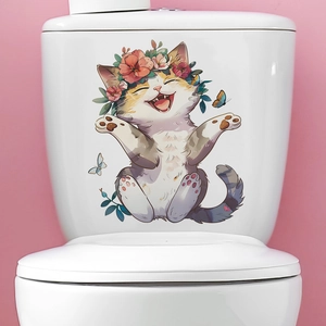 Detail of cute cat wall decal with floral wreath and butterflies on a white toilet tank