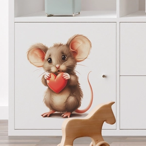 Detail of cartoon mouse holding a red heart wall sticker on a white cabinet surface