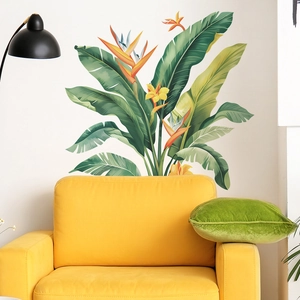 Dettaglio dell'adesivo murale tropicale con foglie verdi e fiori gialli