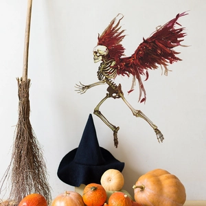 Halloween wall sticker featuring a running skeleton with large red feather wings for home decor