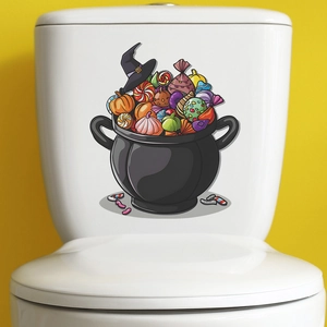 Halloween magic cauldron decal with candy and pumpkin on white toilet surface