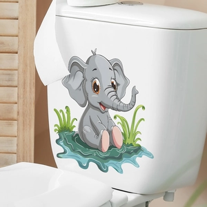 Detailed view of gray cartoon elephant wall sticker applied on a white ceramic toilet tank