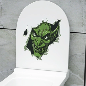 Detail of creative Halloween toilet sticker showing green monster breaking through white surface