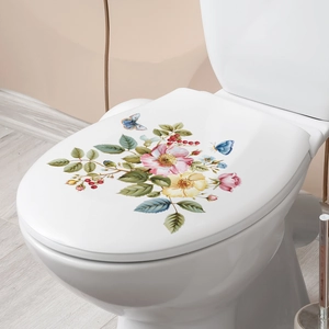 Floral toilet seat decal featuring realistic pink flowers and blue butterflies in bathroom