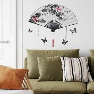 Detail of Chinese style wall stickers featuring ink lotus fan and butterflies in a living room