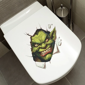 Close-up of 3D green monster toilet sticker with cracked wall effect and scary goblin face