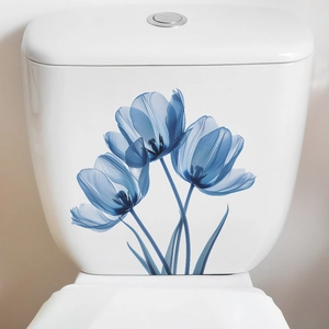 Detail view of elegant watercolor blue tulip floral stickers applied to a white toilet tank