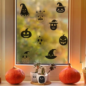 Halloween window decals featuring pumpkins and ghosts on glass with home decor