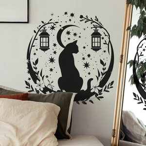 Detail of black vinyl cat and crescent moon wall sticker in a cozy bedroom setting