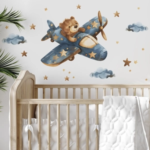 Cartoon bear flying blue plane wall decal for kids room decor with clouds and stars