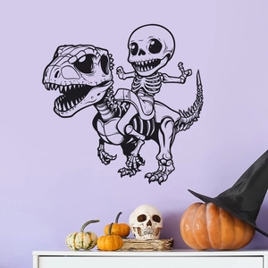 Detail of cartoon dinosaur skeleton wall decal on purple wall with pumpkin decorations