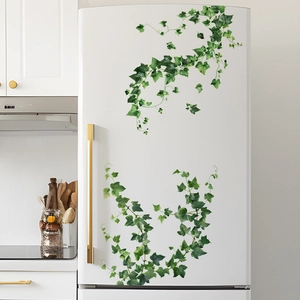 Detailed view of realistic green ivy vine wall stickers applied on a white refrigerator surface