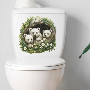 Detailed toilet sticker featuring three 3D polar bear cubs with green leaves and daisies