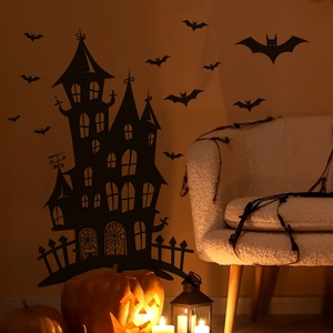 Close-up of Halloween castle and bat silhouette wall stickers in a cozy room setting
