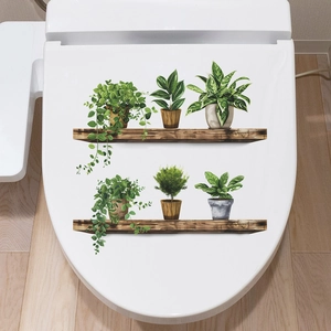 Self-adhesive toilet lid wall sticker featuring realistic green plants on wooden shelves