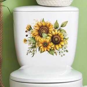Détail des autocollants tournesols vibrants appliqués sur un réservoir de WC blanc