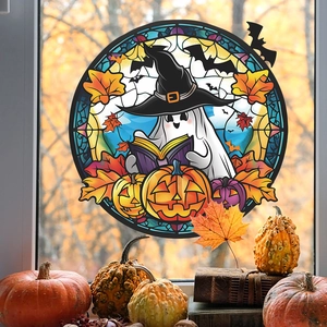 Detail view of a Halloween ghost window sticker with stained glass pumpkin and bat designs