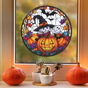 Detail of stained glass style Halloween window cling with ghost, pumpkin, and bat motifs