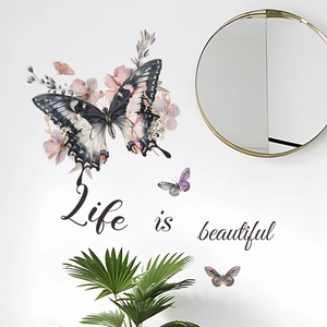 Dettaglio di adesivi murali Life is beautiful con farfalle e fiori su una parete bianca
