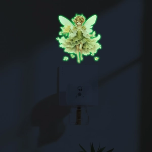 Luminous green forest fairy wall sticker glowing above light switch in dark room decor