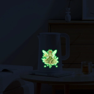 Luminous flower fairy wall decal glowing in dark on a white kettle surface