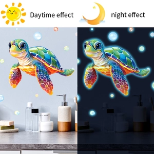 Glow in the dark sea turtle wall decals showing daytime versus nighttime luminous effect
