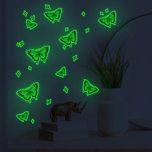 Luminous hollow butterfly and star wall decals with green glow for home decor
