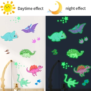 Detailed day and night contrast of glow in the dark cartoon dinosaur wall stickers