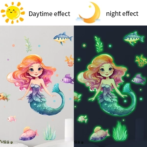 Glow in the dark mermaid wall stickers showing daytime color vs green night light effect