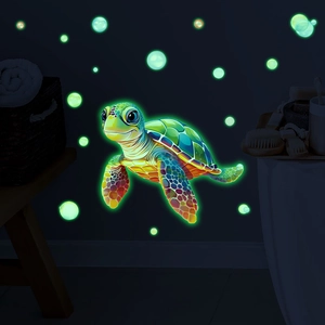 Luminous turtle wall stickers showing green fluorescent glow on dark wall backgrounds