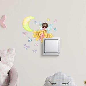 Luminous flower fairy and butterfly wall stickers decorating a white light switch