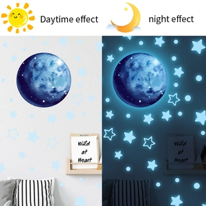 Luminous moon and stars wall sticker set showing daytime and blue glowing night effect