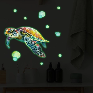 Glow-in-the-dark sea turtle wall sticker with luminous bubbles for bathroom decor