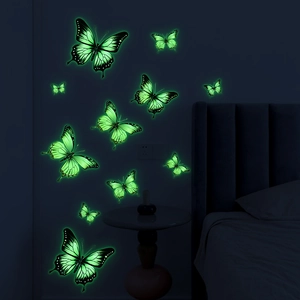 Luminous fluorescent butterfly wall stickers glowing bright green in a dark bedroom
