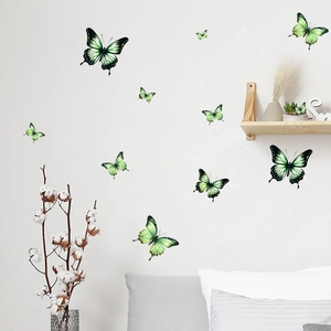 Detail of 3D green gradient butterfly wall stickers on white wall with home decor