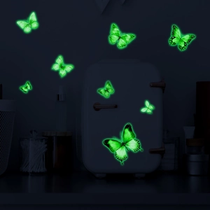 Luminous green butterfly wall stickers in dark home interior for bedroom decoration