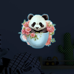 Glow-in-the-dark panda in teacup wall sticker with luminous floral detail in the dark