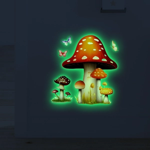 Glow-in-the-dark mushroom wall stickers with butterflies on a dark wall background