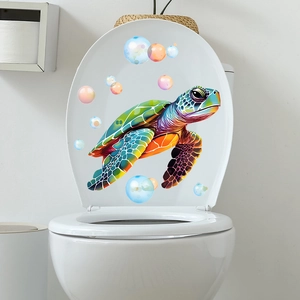Luminous turtle wall sticker with colorful bubbles on white toilet lid background