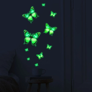 Luminous fluorescent green butterfly wall stickers glowing in dark bedroom setting