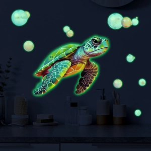 Detail of glow-in-the-dark turtle wall stickers with luminous green bubbles for decor