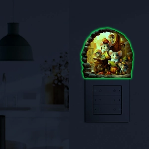 Luminous wall sticker showing cartoon mice reading books near a light switch in the dark
