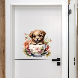 Luminous puppy in teacup wall sticker displayed on a white door in a home setting