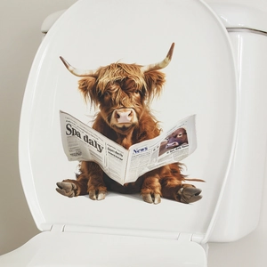 Detail of Highland Cow reading newspaper wall decal on a white ceramic toilet lid