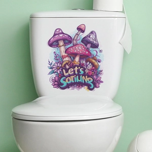 Close-up of purple mushroom and flower stickers applied to a white ceramic toilet tank