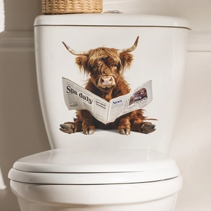 Close-up of humorous Highland cow reading newspaper sticker on a white toilet tank