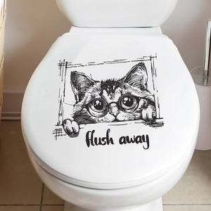 Macro detail of waterproof PVC cat toilet lid decal with funny flush away slogan