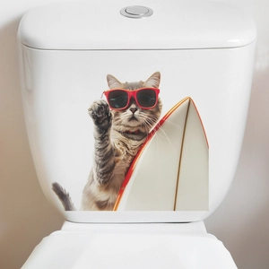 Close-up of funny cat surfing wall sticker on white toilet tank for bathroom decoration